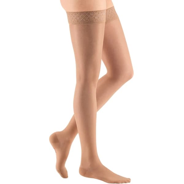 Mediven Sheer & Soft Thigh High 15-20mmHg Compression Stocking with Lace Top Band Standard, Closed Toe, Natural, Size VII - Pair - Image 1
